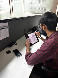 Student of Dice Academy making graphic design on tablet 