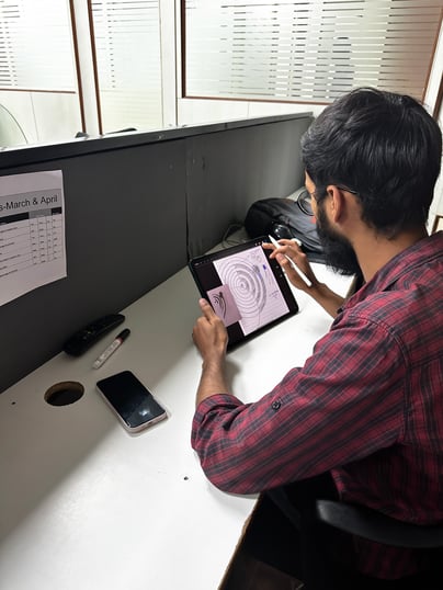 Student of Dice Academy making graphic design on tablet 